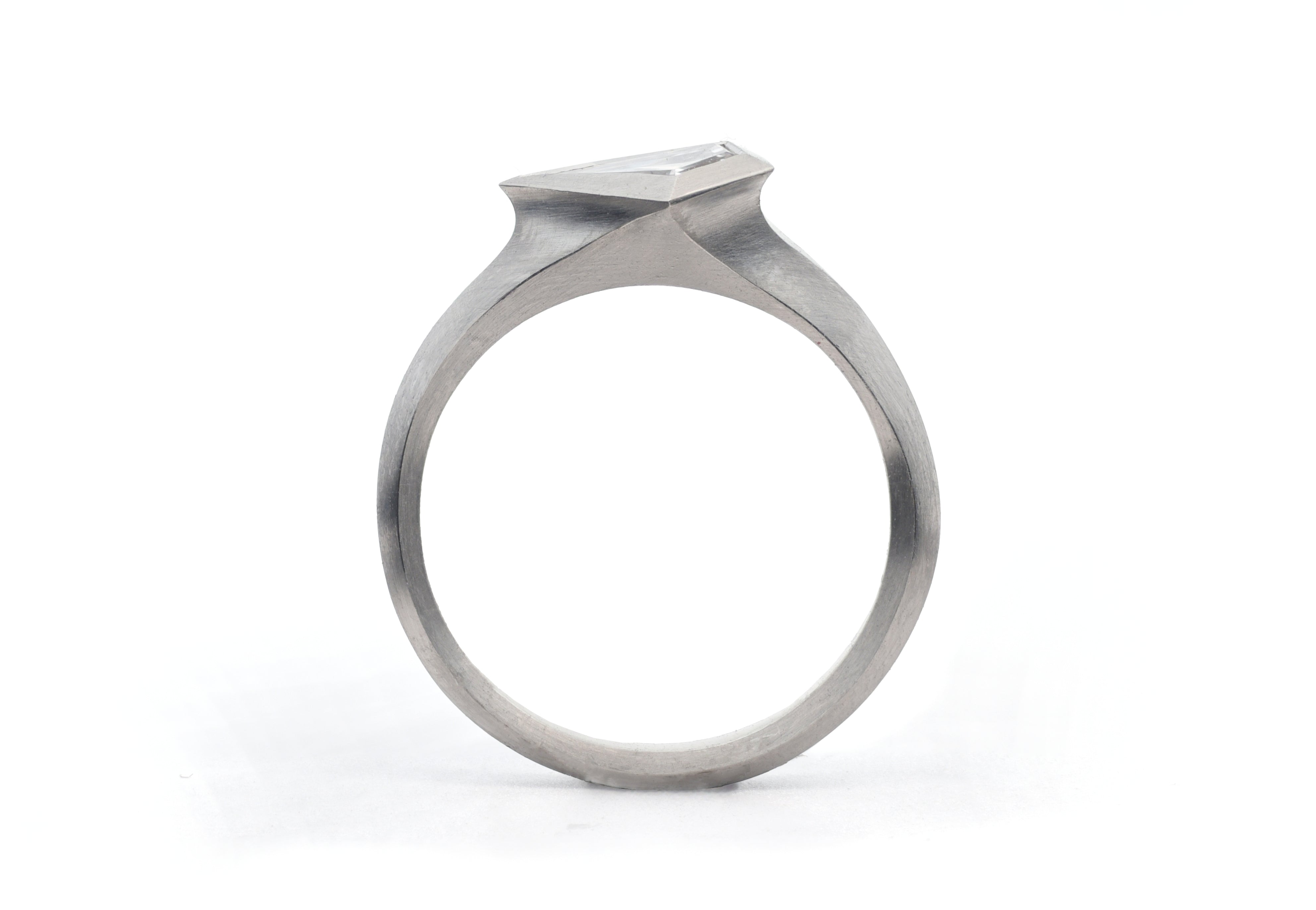 Platinum Aegis fitted ring set with kite shaped diamond