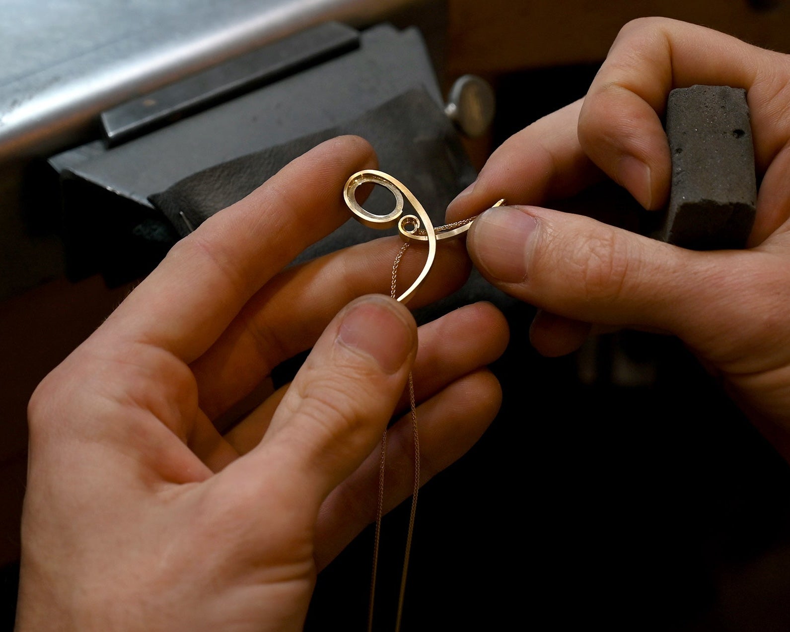art nouveau inspired bespoke pendant necklace being handmade at a jewellers bench