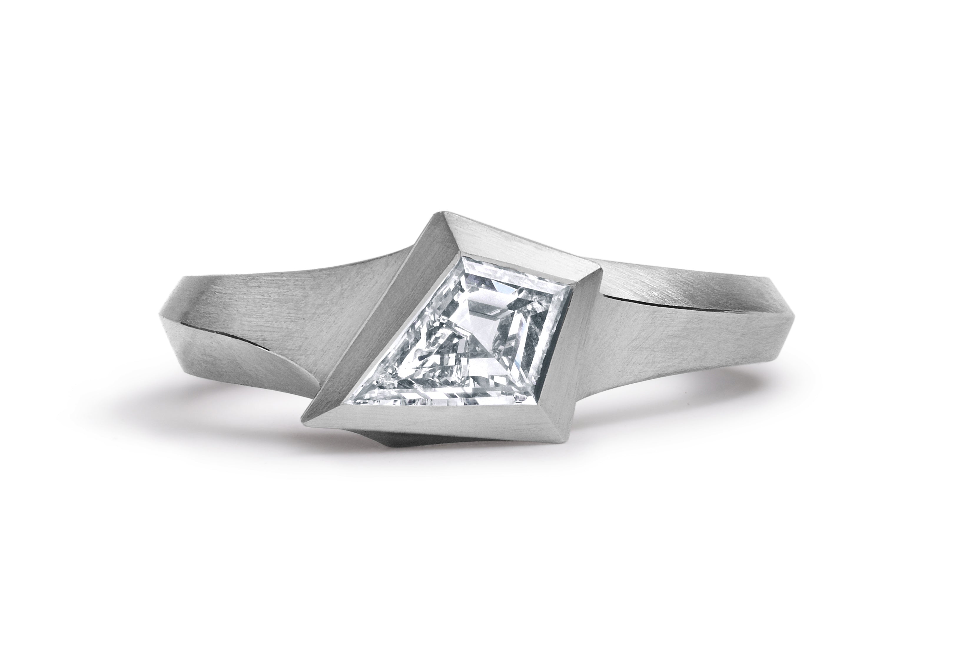 Platinum Aegis ring with kite shaped white diamond.