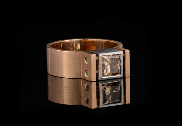 Architect's angular engagement ring with cognac diamond
