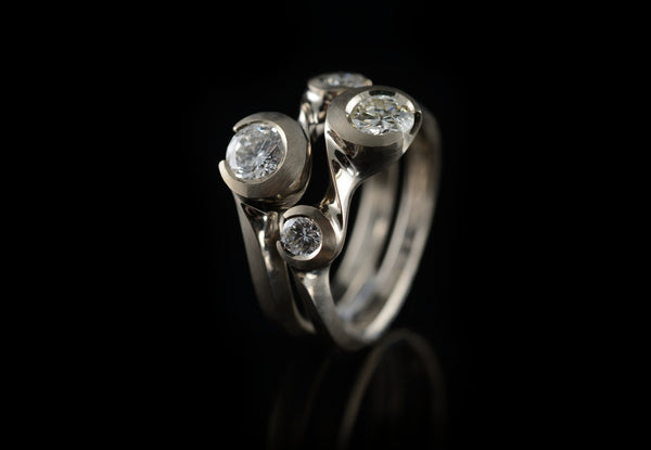 Hand-carved interlocking pair of diamond and gold rings