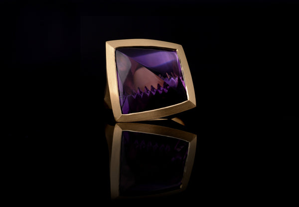 16ct Fancy cut Amethyst cocktail ring set in 18ct gold.
