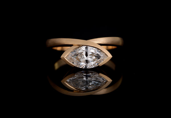 Yellow gold marquise diamond ring with fitted wedding band