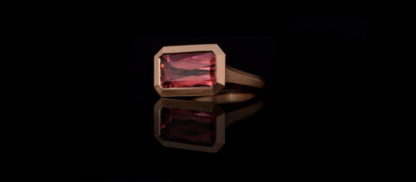 Arris Ring in Rose Gold with radiant Malay Garnet