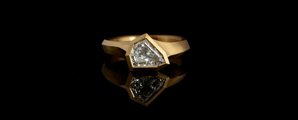 White diamond shield Aegis ring in 18ct yellow gold