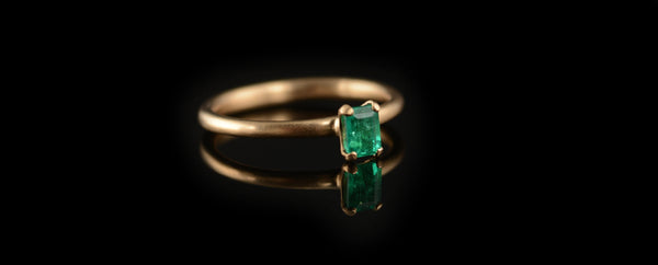 Emerald 4 claw rose gold engagement ring 