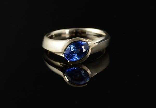 Carved white gold and sapphire engagement ring
