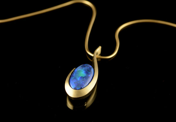 Carved yellow gold and opal pendant commission