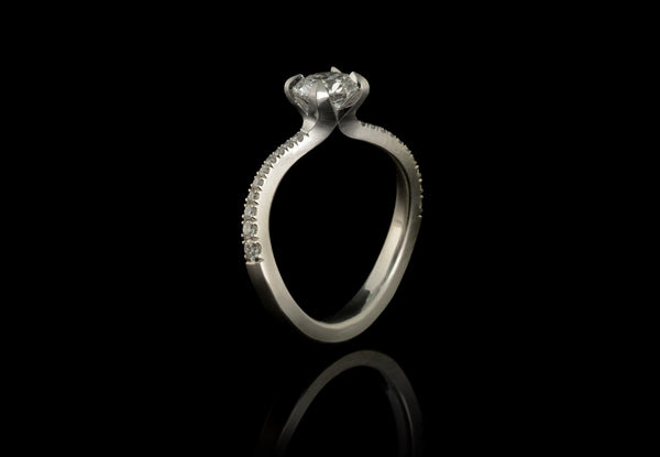 Platinum and white diamond S-curve engagement ring with pave diamond band