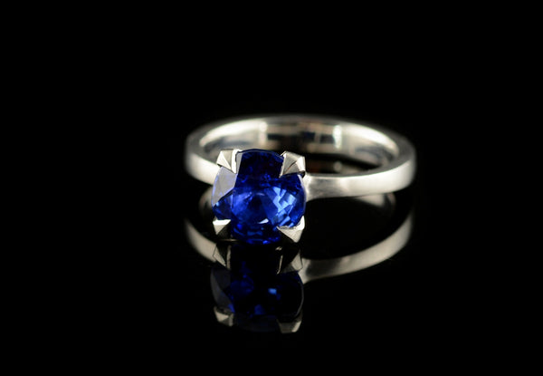 Platinum and sapphire engagement ring with pointed claws