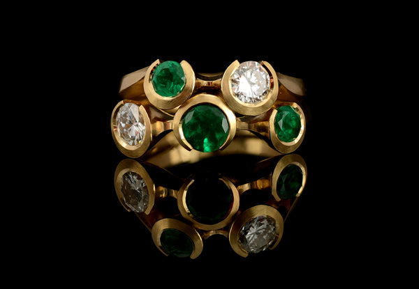 Bespoke pair of yellow gold, emerald and diamond rings