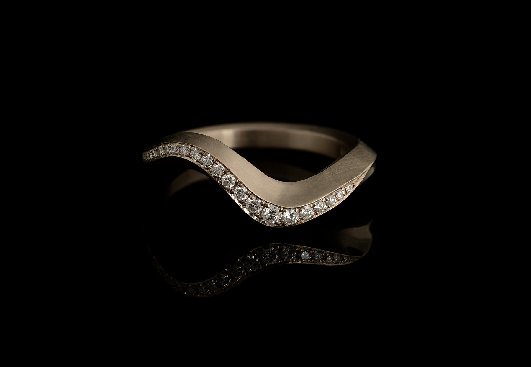 Arris carved wedding ring with pave diamonds