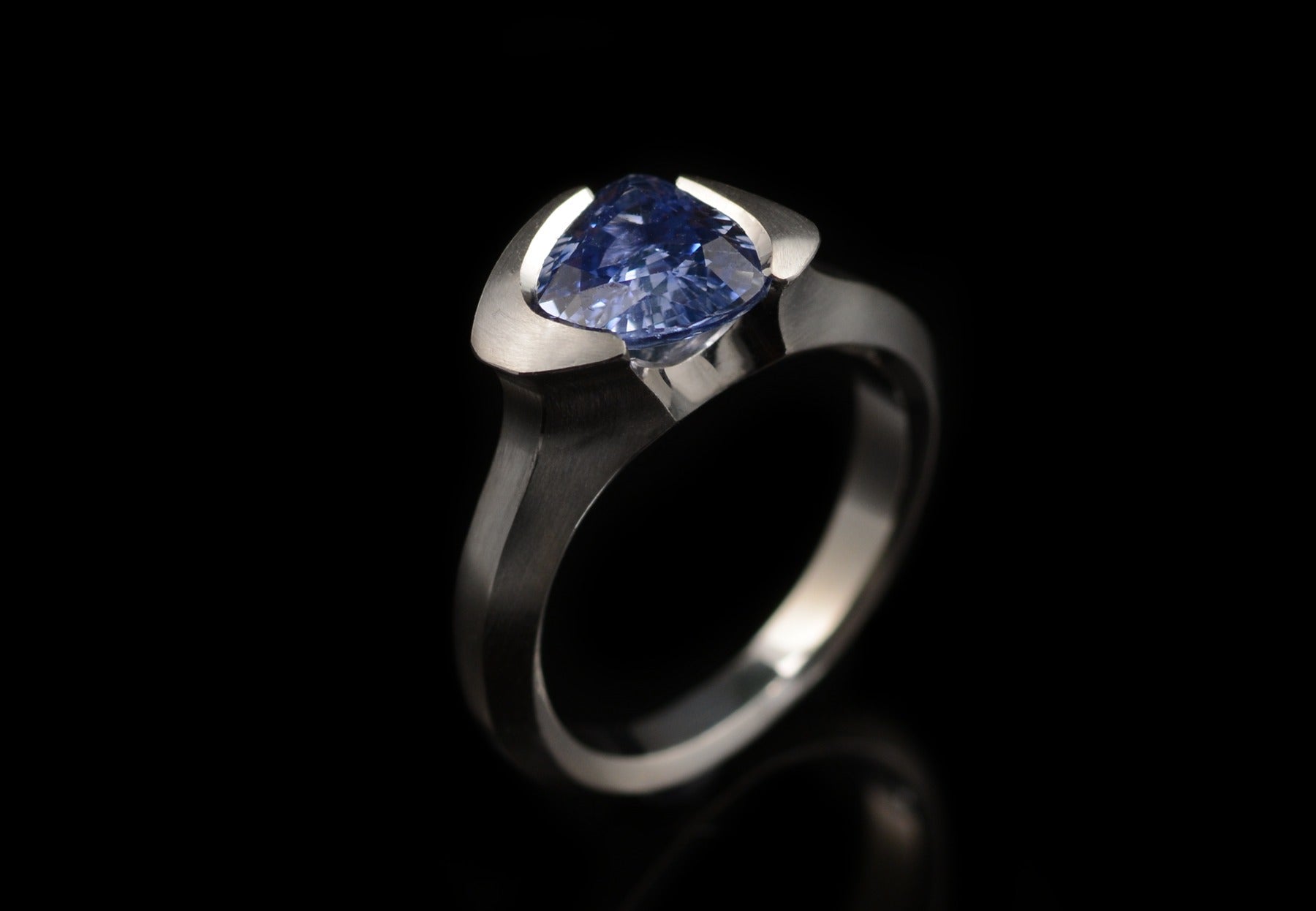 Carved trillion cut blue sapphire platinum cocktail ring