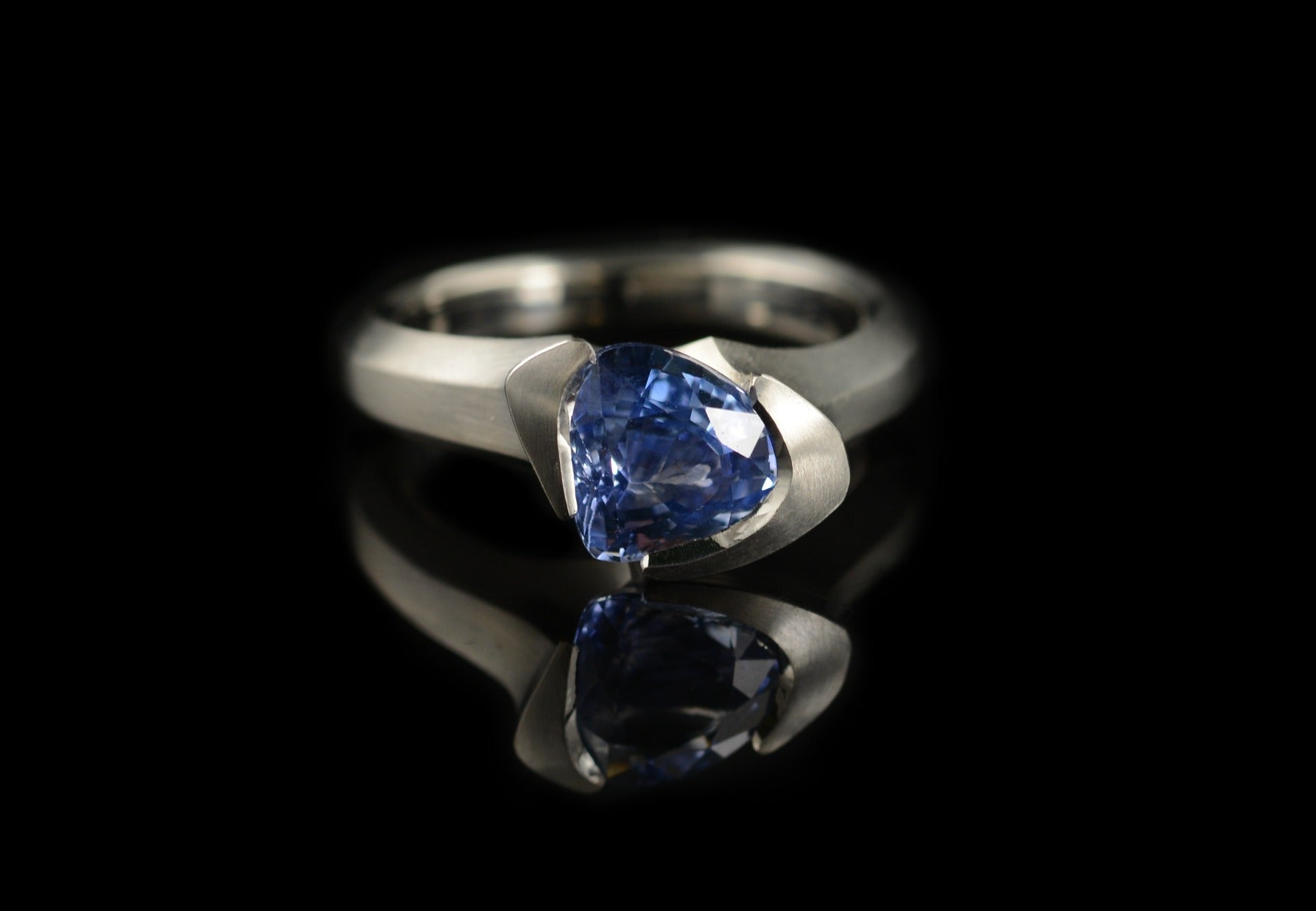 Arris trillion cut blue sapphire and platinum engagement ring