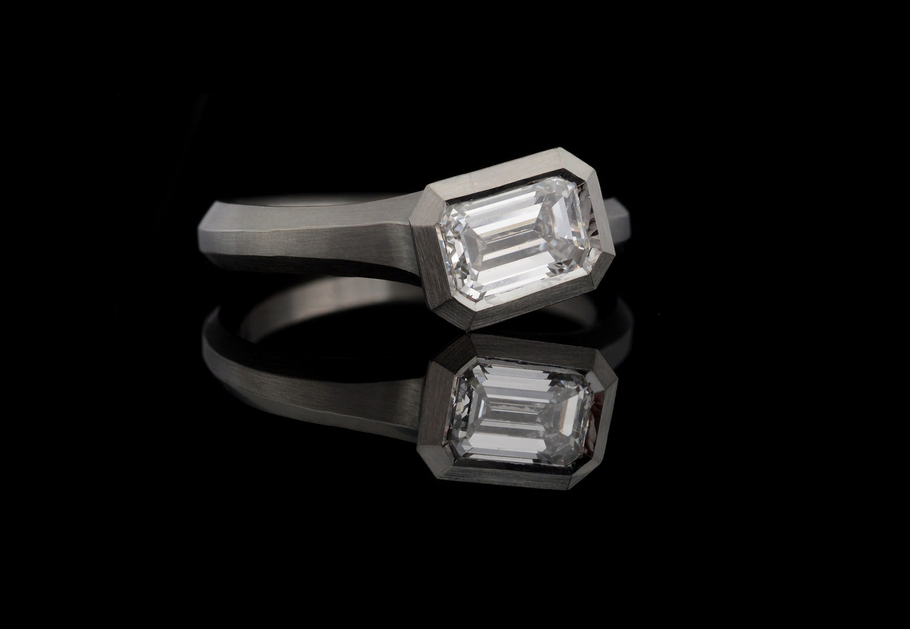 Arris emerald cut white diamond platinum engagement ring