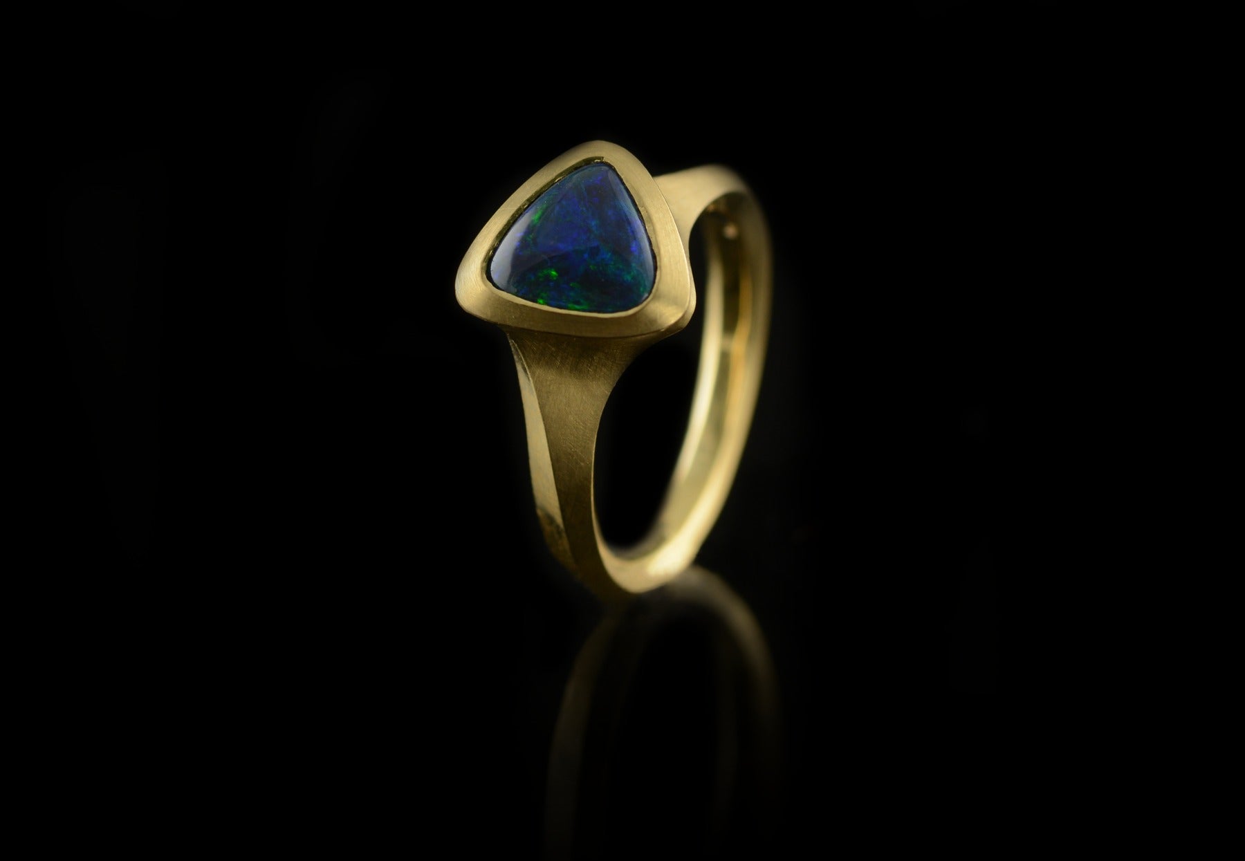 Arris black opal yellow gold ring