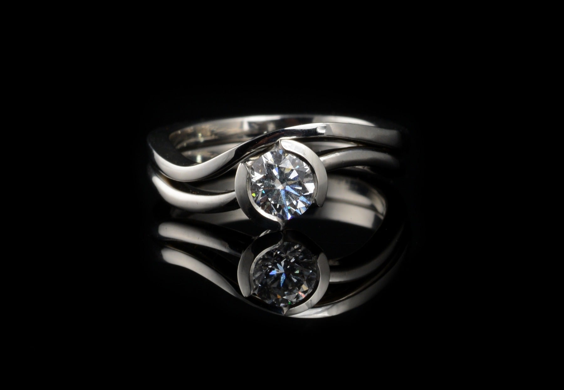 'S Curve' white diamond platinum engagement ring and wedding ring set