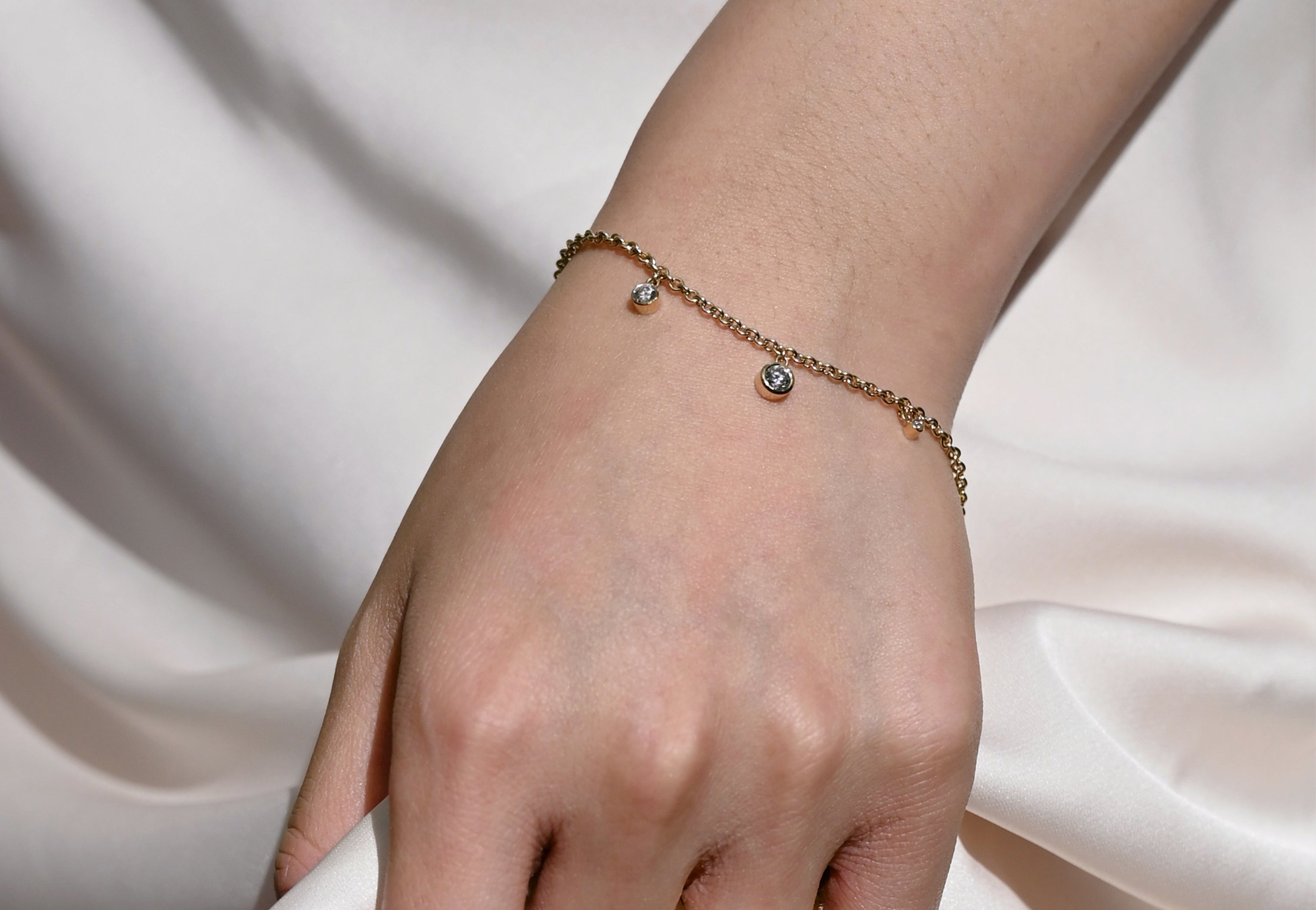 handmade diamond drop bracelet with 3 diamond on 18ct gold chain