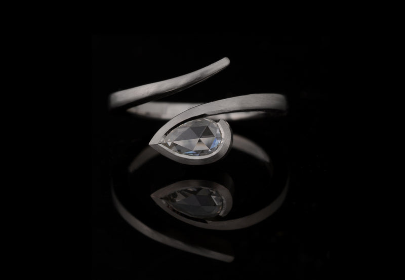 'Twist' Platinum and white pear shaped rose cut diamond engagement ring