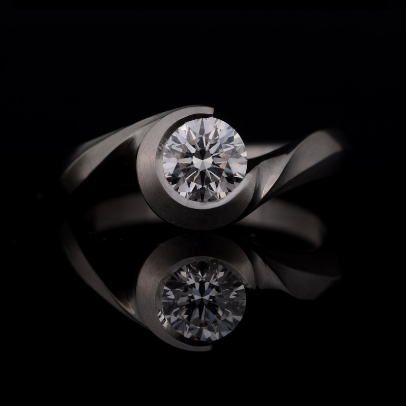 Wave white diamond and platinum engagement ring
