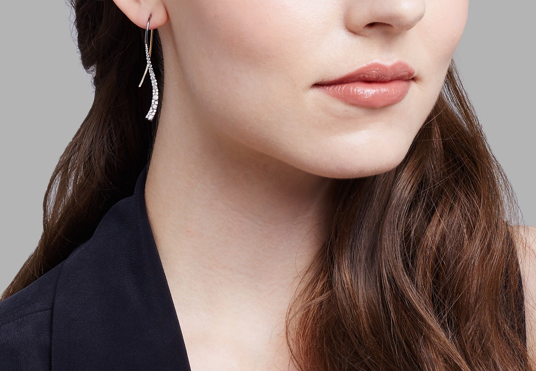 Forged celestial white diamond earrings on model