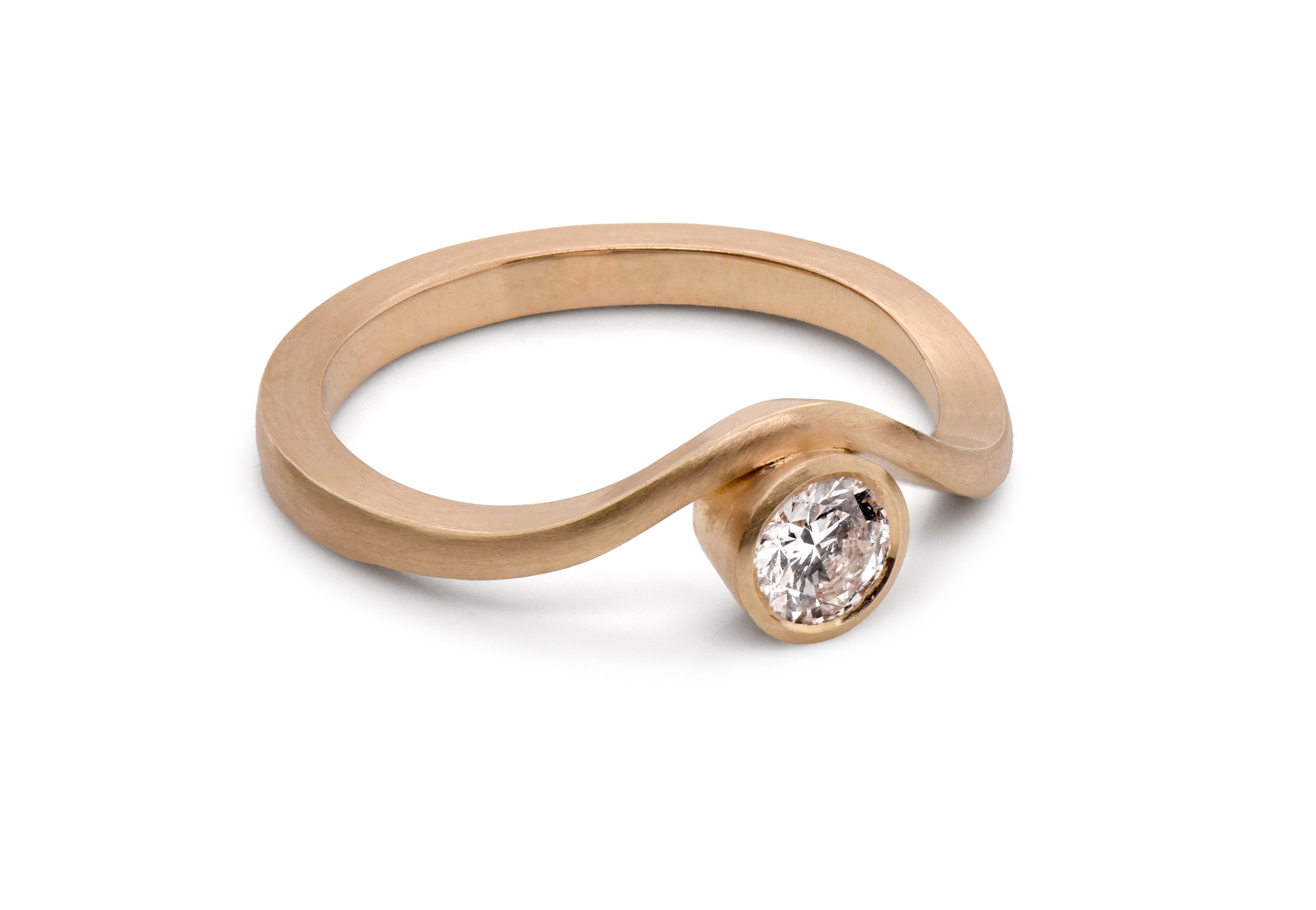Gold curved asymmetric ring with a diamond