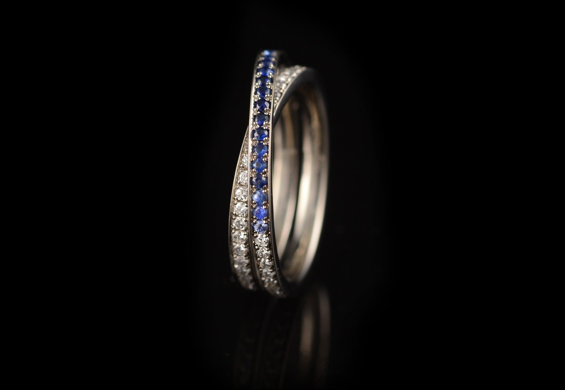 Wrapover blue sapphire and white diamond eternity ring
