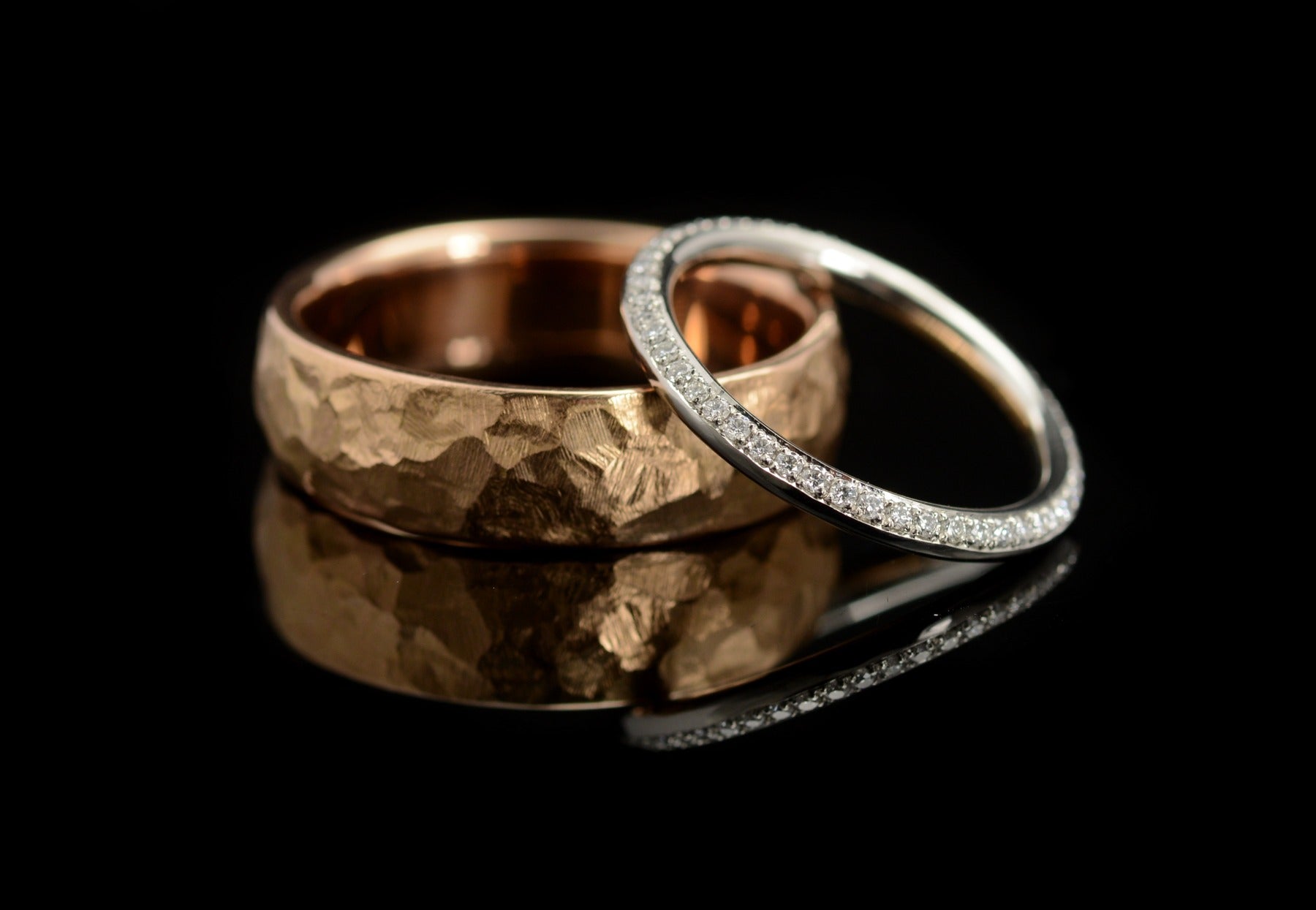 White diamond and platinum ladies wedding ring and hammered rose gold mens wedding ring