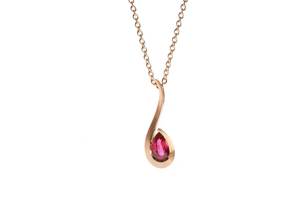 Rose gold and pear shaped ruby twist pendant