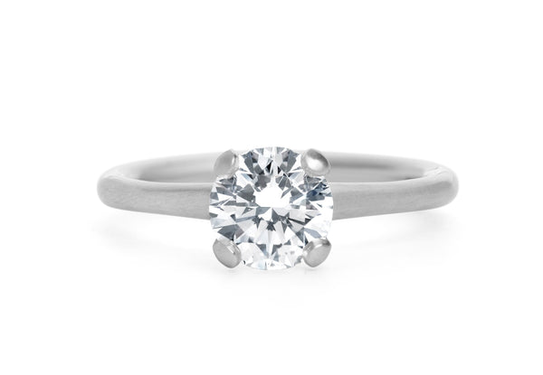 Brilliant cut white diamond and platinum 4 claw sculpted solitaire engagement ring