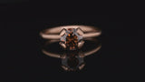 Rose gold calyx engagement ring with cognac diamond