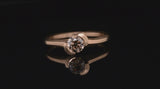 Hand carved asymmetrical rose gold Arris ring with cognac diamond