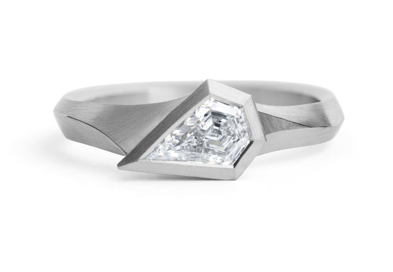 Aegis ring with shield shaped diamond