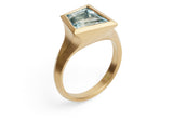 Aegis ring in 18ct yellow gold set with a kite shaped aquamarine