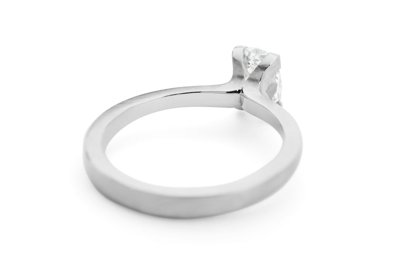 Platinum 4-claw talon engagement ring with oval white diamond