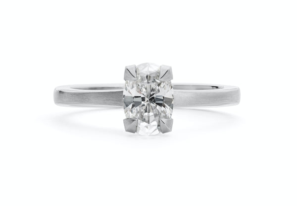 Platinum four claw talon engagement ring with oval white diamond-McCaul
