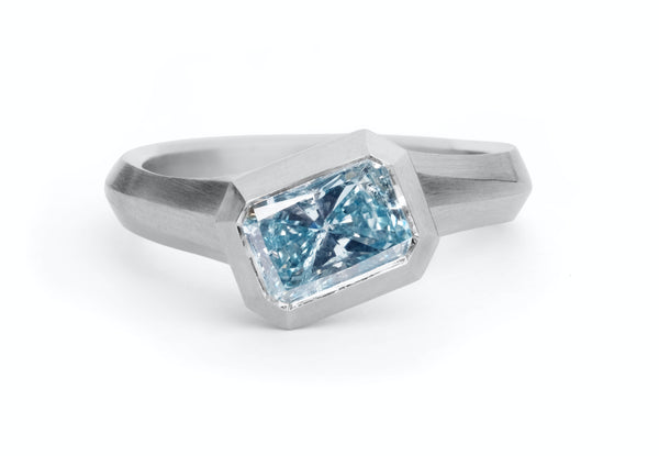 modern blue diamond engagement ring