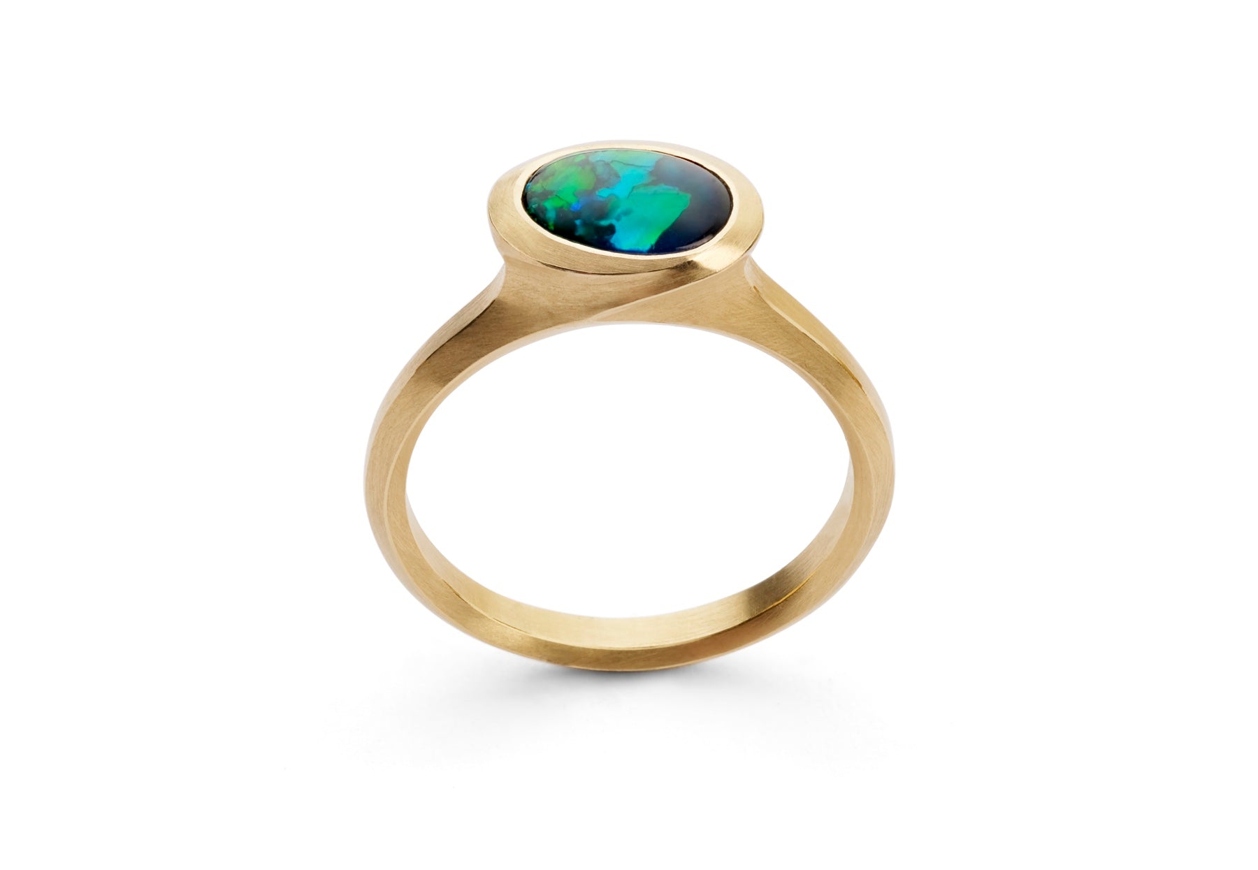 Arris carved yellow gold cocktail ring with oval black opal