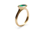 Arris carved yellow gold cocktail ring with oval black opal