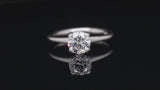 Sculpted platinum 4 claw white diamond engagement ring